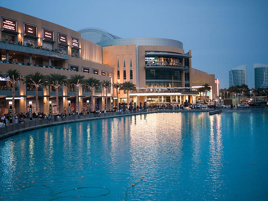 Outside at night, there's a fountain show that attracts a big crowd.