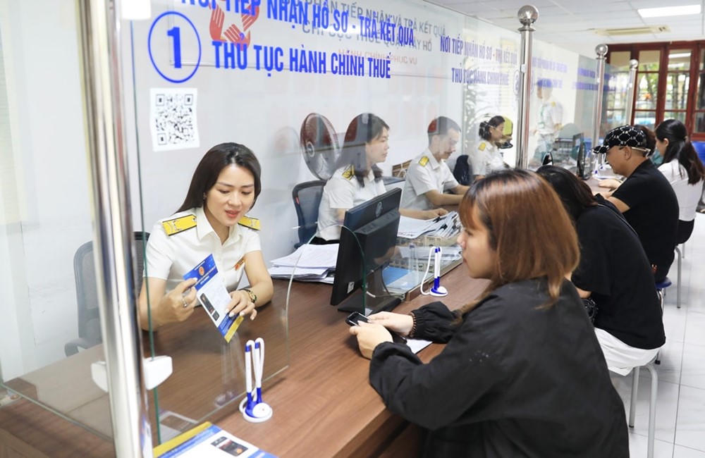 Ngành Thuế cam kết hỗ trợ miễn phí khi hộ kinh doanh chuyển sang hóa đơn và kê khai điện tử - ảnh 1